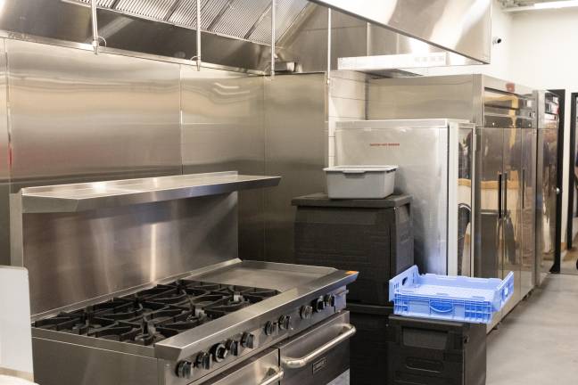 The kitchen for feeding volunteers is shown.