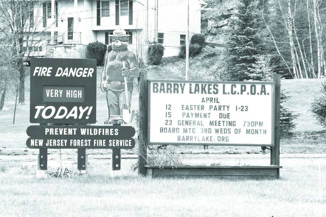 PHOTO BY CHRIS WYMAN Photos taken of the New Jersey Forest Fire Service sign in front of the Barry Lakes clubhouse on Saturday indicated the possibility for forest fires still exists.