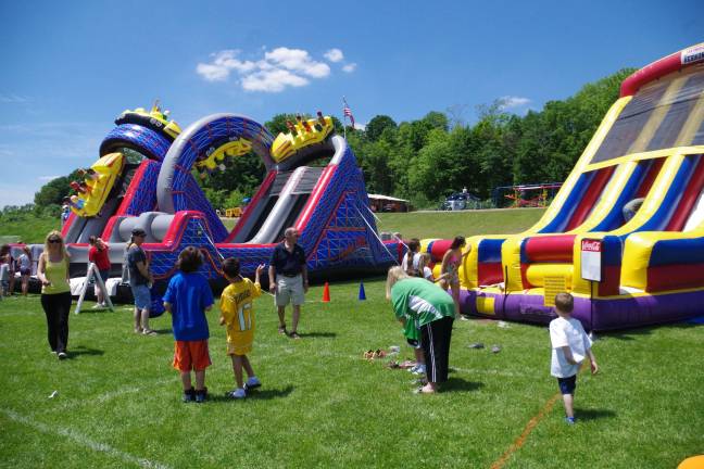 The Vernon PAL slide was one of three inflatable attractions for the children at the annual Vernon Day event held at Maple Grange Park.