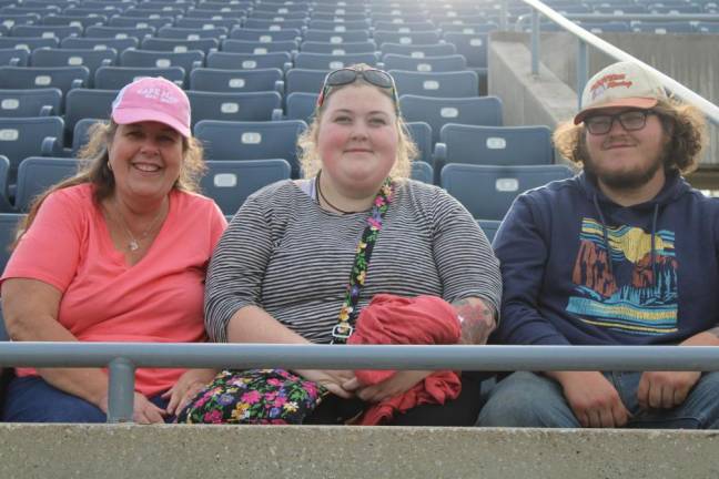 From left, Mary Ann, Erica and Connor Schaberg of Wantage are ready for the game.