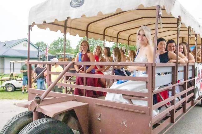 Queen of the Fair contestants take a ride through the fair before the pageant (Photo by Sammi Finch)