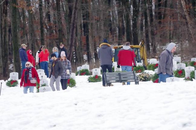 People place wreaths on the graves of veterans after the ceremony Saturday, Dec. 17 at the Northern New Jersey Veterans Memorial Cemetery in Sparta.
