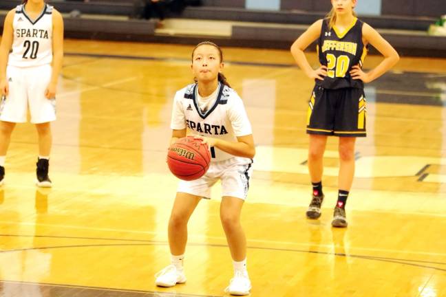 Sparta's Ellen Villapando holds the ball as she focuses from the free throw line. Villapando scored 14 points.