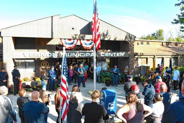 <b>Residents and officials gather at the Vernon municipal building for the ceremony.</b>