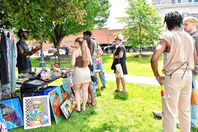 JN1 People shop at the fifth annual Juneteenth celebration, hosted by the H3AL Network, on June 21 at the Newton Green. (Photo by Maria Kovic)