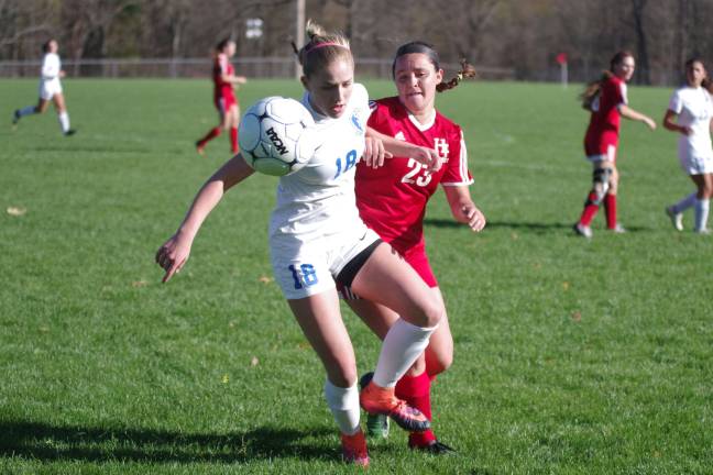Kittatinny's Olivia Redden battles High Point's Brianna Simsic for control of the ball.