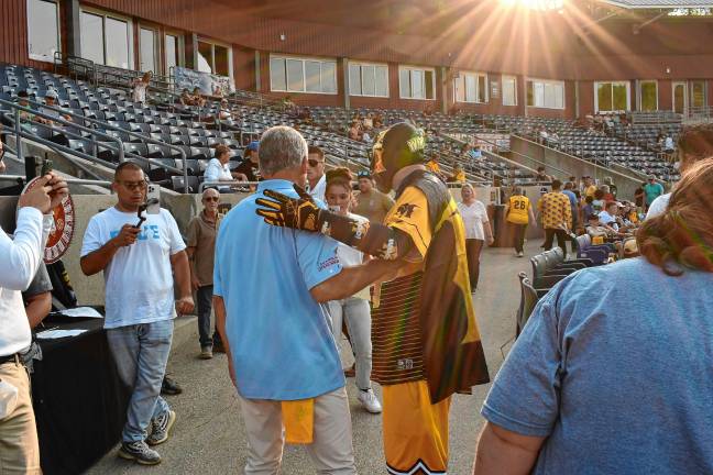 <b>Jack Ciattarelli and the Miner Man pose for photos at Skylands Stadium.</b>