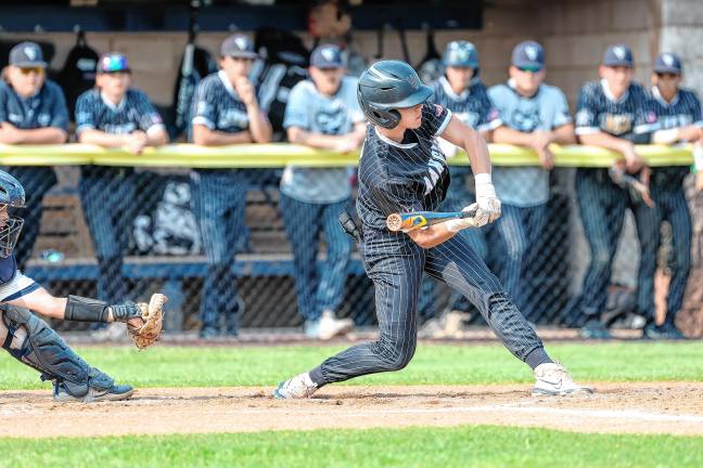 Zack Clarken holds back his swing on a called ball in the top of the fifth inning against Pequannock.