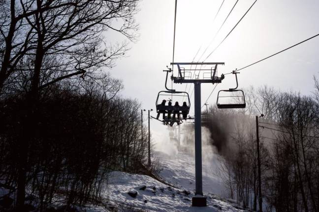 Skiers ride the chair lift Sunday, Dec. 18 at Mountain Creek.