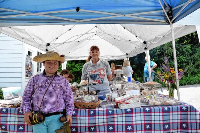 <b>Heath Ziccardi, 10, poses with Janet Woudenberg, who is selling lunch and homemade treats.</b>