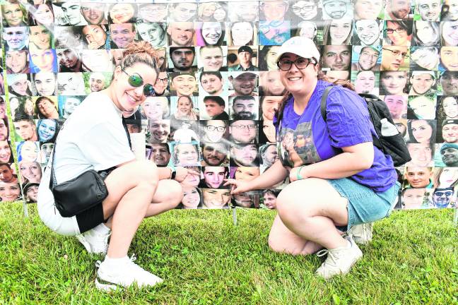 Jasmine Mullen of Hackettstown and Ashley Caramanna of Hopatcong point to a photo of Salvatore Caramanna, who died in 2021 from drug addiction at 20 years old.
