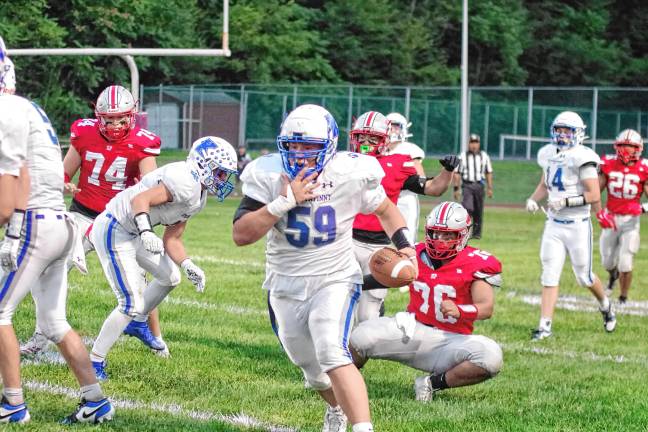 <b>HP2 Kittatinny defensive lineman Shane Weiss carries the ball after intercepting it during a failed two-point conversion play by High Point in the first half.</b>