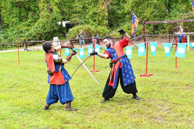 Two knights demonstrate their sword-fighting skills Sunday, Sept. 7 at the Sparta Renaissance Festival. (Photos by Maria Kovic)