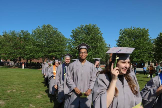 Sussex County Community College graduates march.