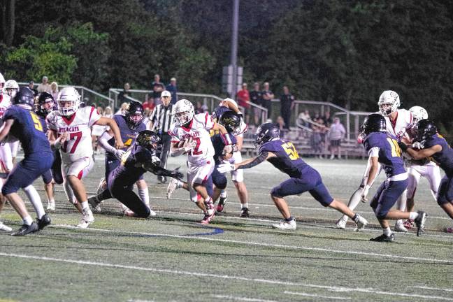 <b>JF3 Whippany Park ball carrier Nick Casale runs through an opening in the Jefferson defense in the first half. He made it to the end zone for a touchdown. The extra point kick tied the score, 14-14, in the second quarter.</b>