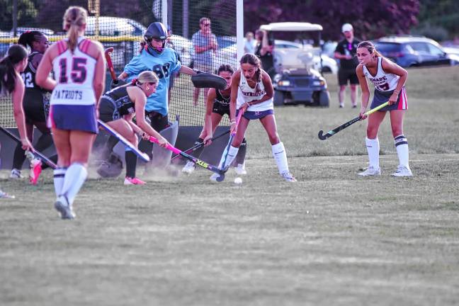 Lenape Valley and Wallkill Valley field hockey players battle for control of the ball in front of the goal during the season-opener Sept. 3 in Hamburg. The Patriots won, 2-0. (Photos by George Leroy Hunter)