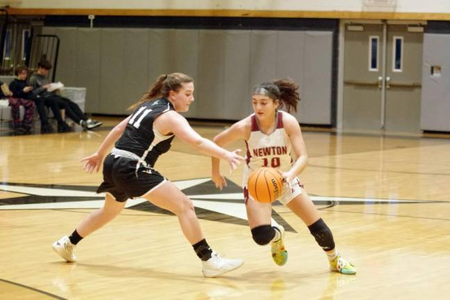 Newton's Sophia May maneuvers the ball past Wallkill Valley's Rebecca Krueger.