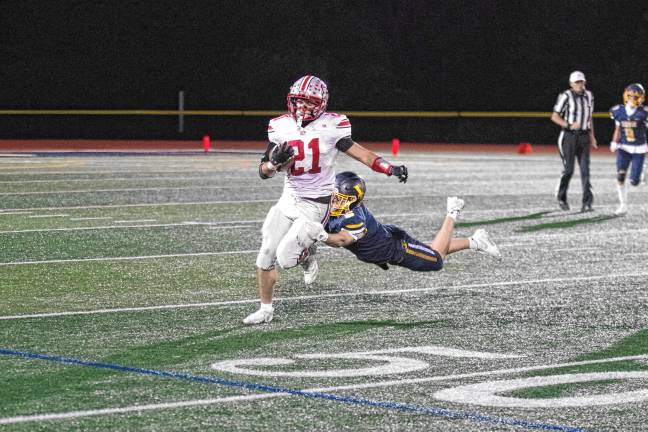 High Point ball carrier Brendon Lehman is caught from behind by Vernon defender Gavin Bruno in the second quarter. The Vikings won, 35-28, at home Friday, Oct. 3. (Photos by George Leroy Hunter)
