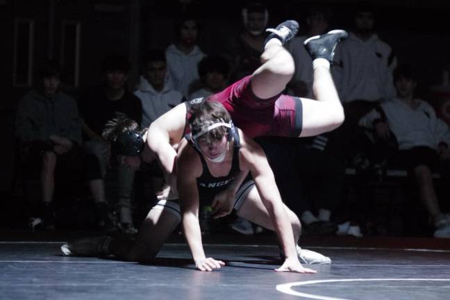Pompton Lakes' Chad McConnell maneuvers over the top of Wallkill Valley's Nicolas Hamarcak in the 175-pound weight class. McConnell won by technical fall (18-3) in 3:45.