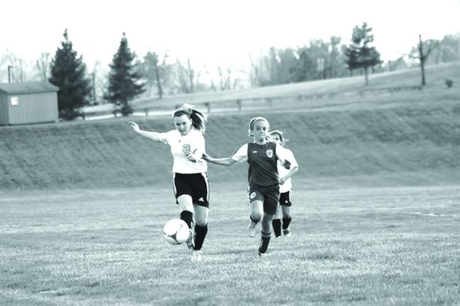 Morgan Myles clears the ball.