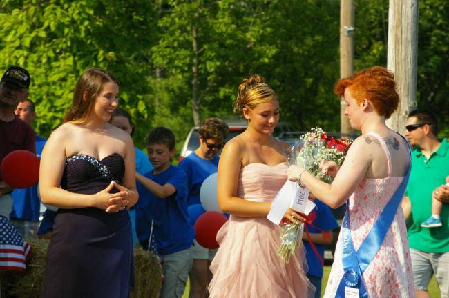 At the far right Miss Franklin 2013 Emily VanDyk presents flowers to Miss Franklin 2014 Alyssa Preziosi as first runner up Mary Kate Hubbard looks on.