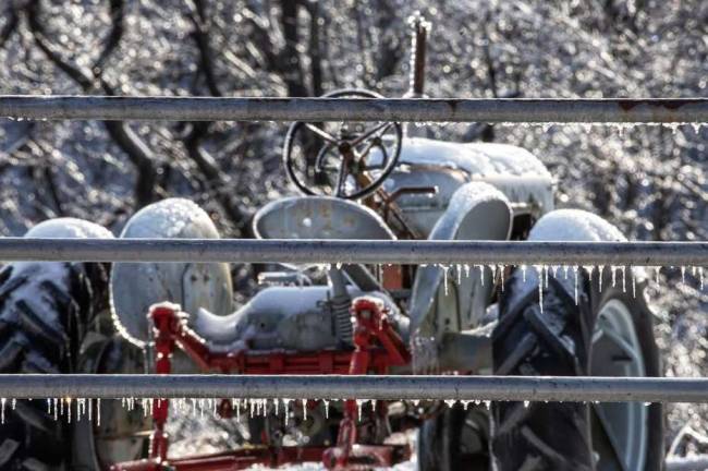 This photo by Ami Schecter, who lives along the PaulinsKill River, snapped a shot of an ice-laden tractor.