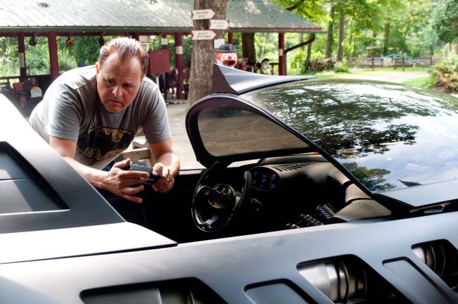 John Sbright, auto-mechanic, who built both Batmobiles is double checking the electronics in the reproduction 1995 Batmobile.