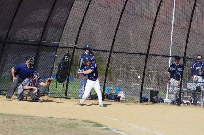 Sparta's T.J. Estanislau begins his swing at an incoming ball.