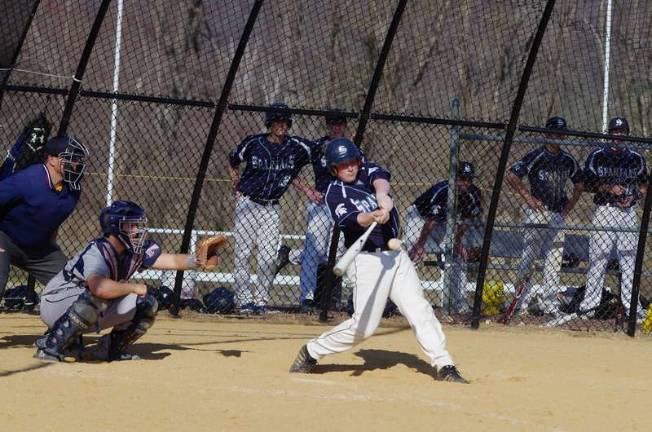 Sparta's Michael Meisel swings hard during an at-bat against Jefferson High School.