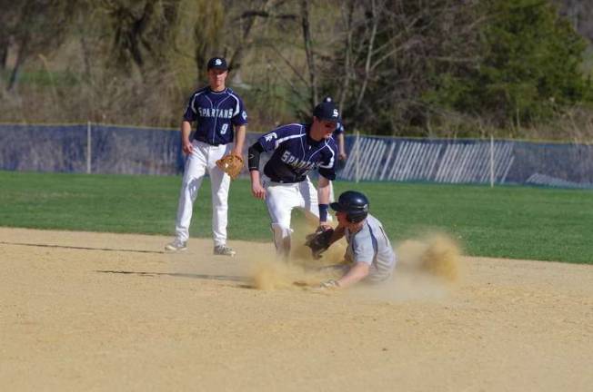 Sparta second baseman Austin Unglaub tags out a Jefferson runner. Jefferson Township High School defeated Sparta High School in varsity baseball on Monday, April 21, 2014. The final score was 5-4. The game took place at Sparta High School.