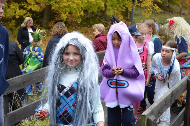 Young, costumed students line up to enter Westwind Manor.