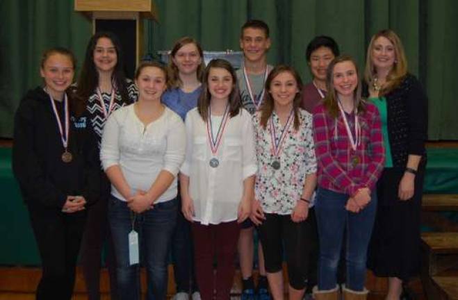 Eighth-grade winners are shown with sience teacher Michelle Cooper