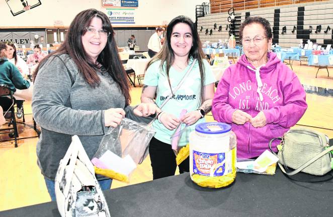 Sherri and Tina Janzen from Ogdensburg pose for a hoto with Annette Osten from Parsippany.