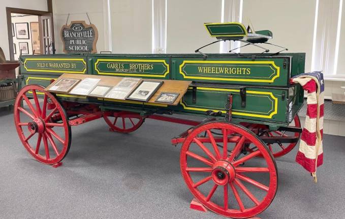 The large farm wagon, previously located in the old Garris blacksmith and wagon shop, was refurbished by Mike Clune.