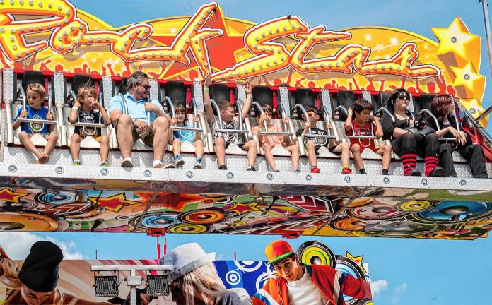 <b>Fair-goers take a ride Saturday, Aug. 2. (Photo by Nancy Madacsi)</b>