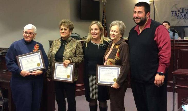 PHOTOS BY DIANA GOOVAERTS Joan Romaine, Emily Bazelewich and Sally McGrath stand with Borough Administrator Alison Littell McHose and Councilman Stephen Skellenger after being recognized for more than 45 years of service each at the polls.