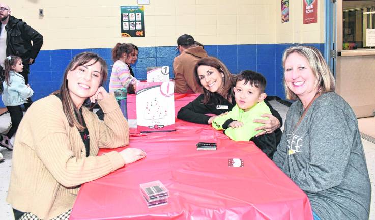 Leslie Gallagher and Mary Muller from Mathnasium in Sparta are show iwth Logan and Kristina Muller of Hardyston.