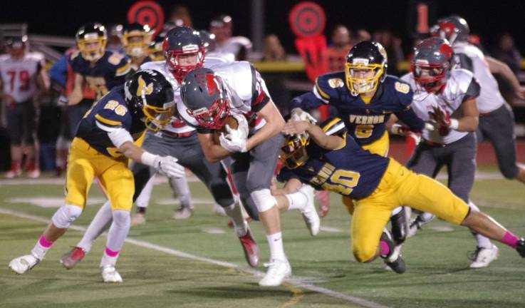 High Point running back Rob Turro rushes forward with the ball in the first half. High Point Regional High School (Sussex, N.J.) defeated Vernon Township High School in varsity football on Friday, October 20, 2017. The final score was 42-14. The game took place at Vernon Township High School in Glenwood, New Jersey.