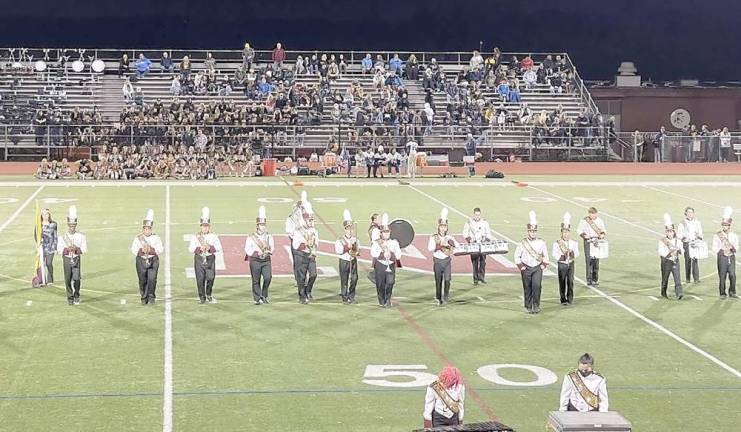 The Newton High School Marching Band at Friday’s season opener football game performing on the field (Photo provided)