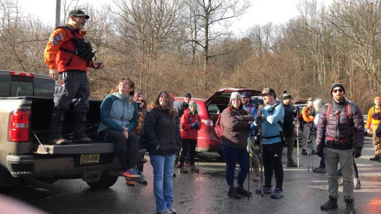 John Rovetto, left, a New Jersey Search and Rescue volunteer who organized the First Day Challenge Hike on Sunday, Jan. 1 in High Point State Park, speaks before the hike begins.