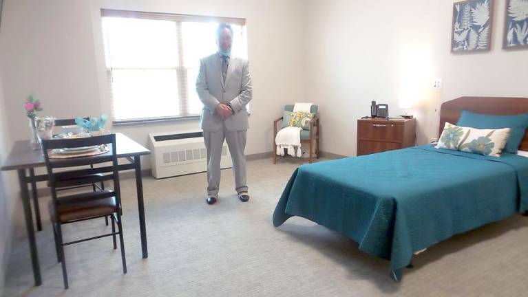 Mike Kelly of Senior Health Care Solutions in one of the rooms. (Photo by Frances Ruth Harris)