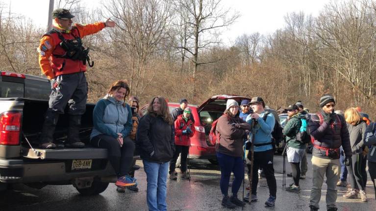 John Rovetto, left, a New Jersey Search and Rescue volunteer who organized the First Day Challenge Hike on Sunday, Jan. 1 in High Point State Park, gives instructions to the crowd. (Photos by Kathy Shwiff)