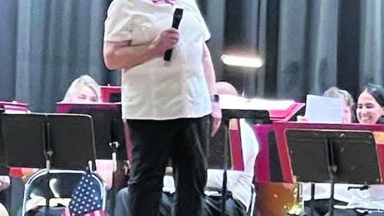 Conductor Judy Bobiak speaks at the Franklin Band's spring concert.
