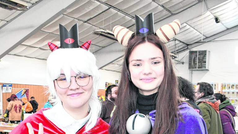 <b>Teryn Hardy of Sussex and Leah Bischooff of Branchville cosplay as characters from Cult of the Lamb.</b>