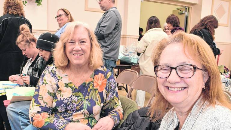 Susan Long of Sparta and Mary Gange of Sparta wait for the rafle to be called.