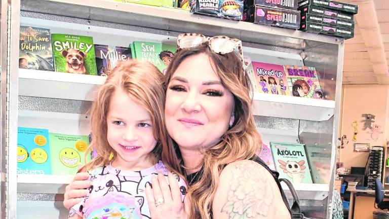 Francesca and Melissa LoPorto pose for a photo.