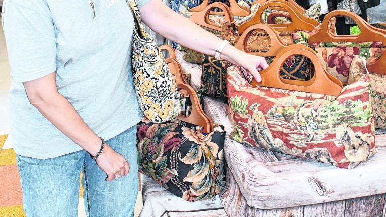 Fran Weiss of Hambug shops for a bag.