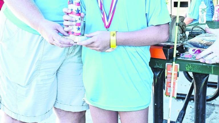 Macie Barry of Wantage won a medal for a 14-inch catfish, the largest fish medal.
