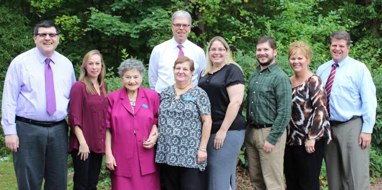 Tom Shara stands with Lakeland colleagues who reached service anniversaries of 20 to 40 years. From left to right: Debbie Morris, Laurie Corcoran, Karen Kennedy, Connie Meehan, Maureen McCully, Patricia Dorrbecker, Patricia Foster, Ruth Schreiber, Joanne Paddock and Bob Vandenbergh. Not pictured: Michele Gilchrist, Janice Hicks, Matt Salmon, and Yvonne Sebecke.