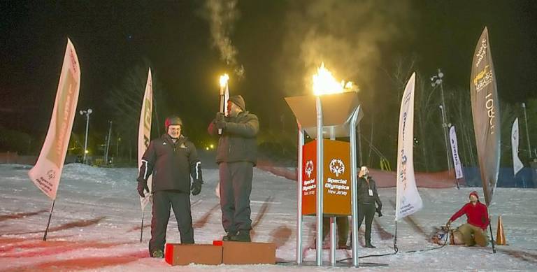 The torch is lit at opening ceremonies.